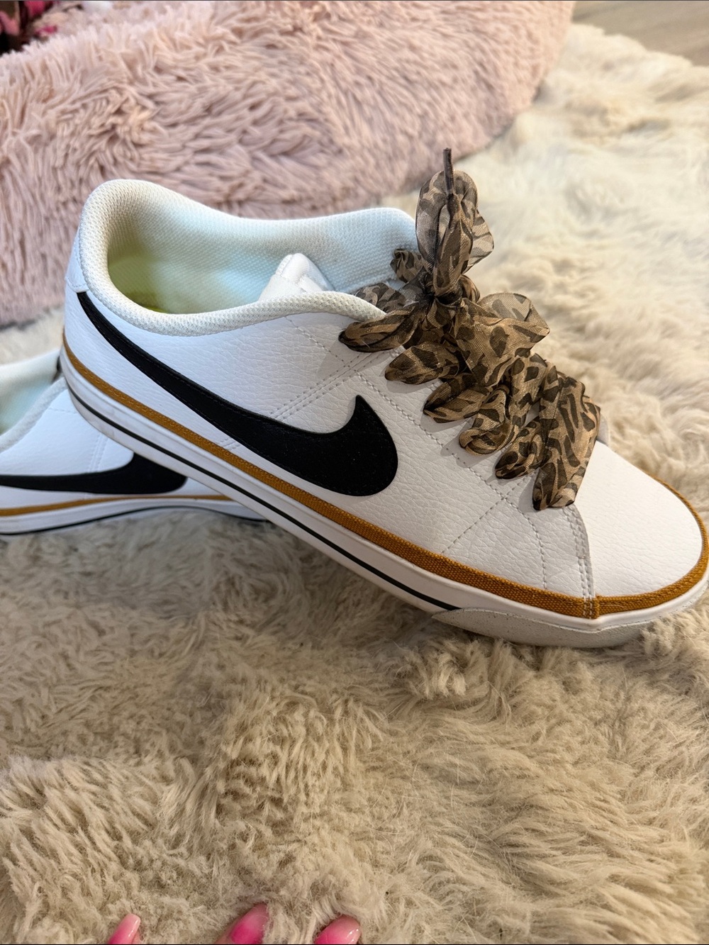 Nike White Low-Top Sneakers with Black Swoosh and Gold Trim, Leopard Laces